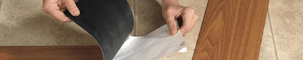 A professional installing vinyl flooring in Orange, CA